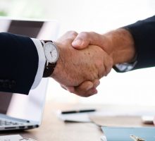 Business professionals shaking hands